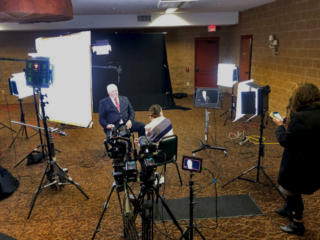 Video crew recording an interview